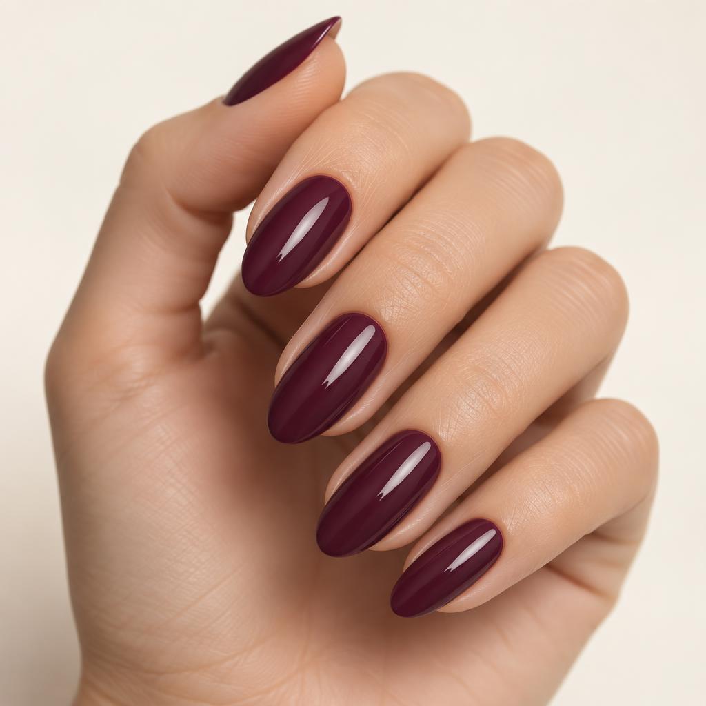 A glossy deep plum manicure captured with Nailfie
